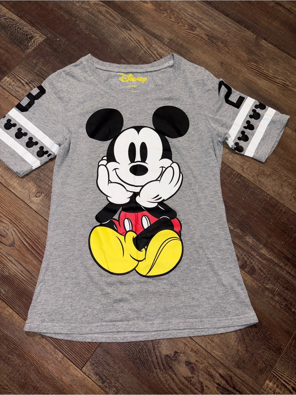 This officially licensed Disney varsity-style graphic t-shirt woman’s size L